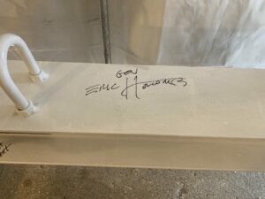 Indiana Governor Eric Holcomb's signature on the structural beam.