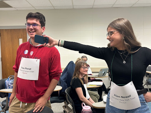 Kayla Price, playing the composite character of New York Times reporter Allen Newall interviews Andrew Metrick in his role as politician Ross Perot.