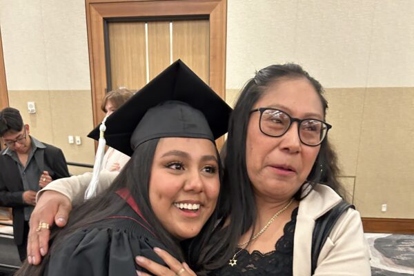 graduating student hugging her mother