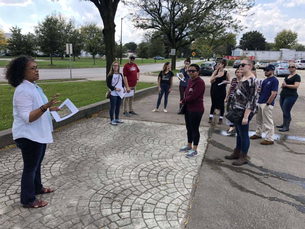 Phyllis Boyd, Executive Director of Groundwork Indy, leads museum studies students in the Climates of Inequality research seminar on a tour of the Riverside neighborhood.