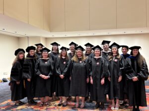 Graduating Museum Studies students in the class of 2025 and the faculty 