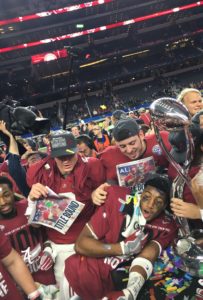 Alabama players strewn in confetti celebrate on the field at AT&T Stadium in Arlington, Texas, following their 38-0 rout of Michigan State in the College Football Playoff semifinal. The Crimson Tide will play No. 1 Clemson in the College Football National Championship game on Jan. 11 in Glendale, Arizona. (Photo by Jessica Wimsatt)