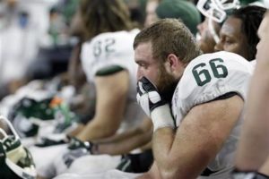Michigan State center Jack Allen reacts in the final minutes of the Cotton Bowl loss to Alabama on Dec. 31 in Arlington, Texas. Alabama won 38-0 to advance to the championship game. (AP Photo | Tony Gutierrez)